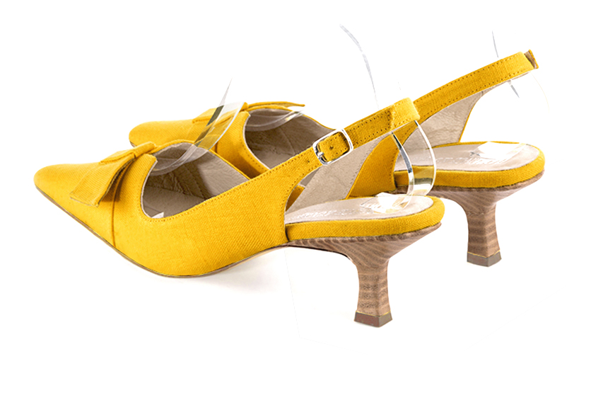 Yellow women's open back shoes, with a knot. Tapered toe. Medium spool heels. Rear view - Florence KOOIJMAN
